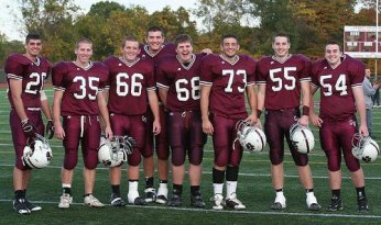 My brother, Connor, the tallest, and of course arms around his team